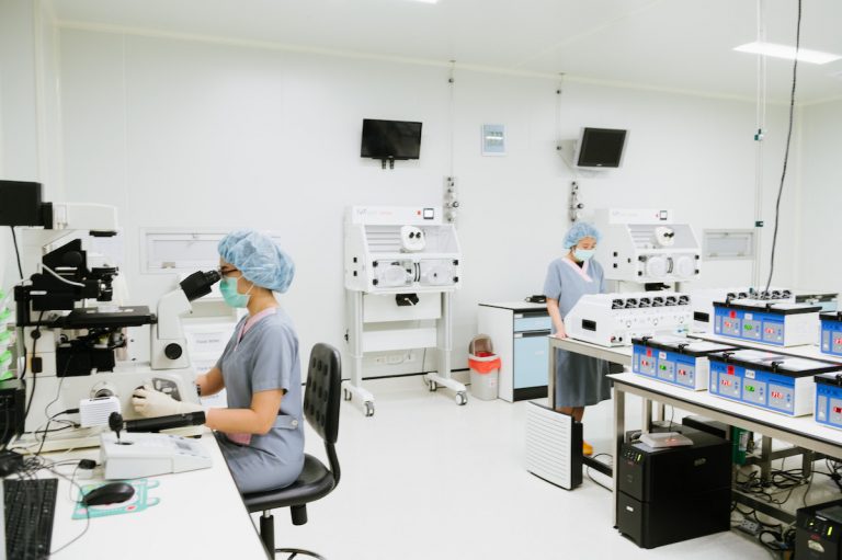 Scientists working in embryology lab